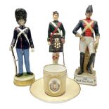 Three soldier figures comprising ?Rudolf K�mmer Volkstedt figure of Den Kgl. Danske Livgarde