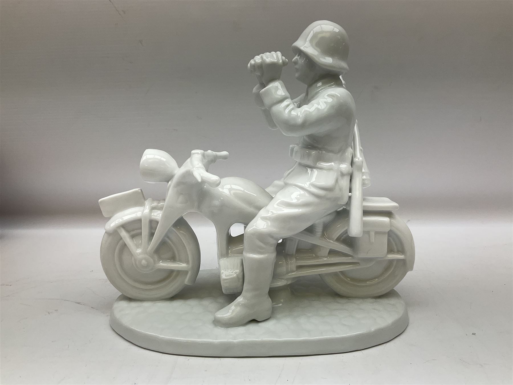 Neundorf figure modelled as a soldier seated upon a stationary motorcycle looking through binoculars - Image 8 of 8