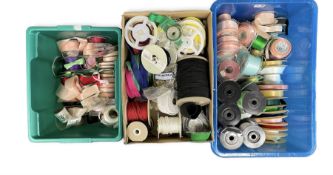 Haberdashery Shop Stock: Reels of satin ribbon in varying colours and sizes