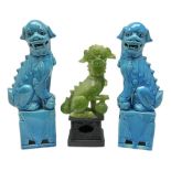 20th century pair of blue glazed Foo Dog statues raised upon a square plinths