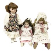 Three porcelain headed dolls