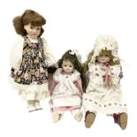 Three porcelain headed dolls