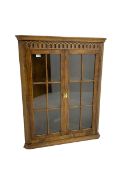 Oak corner cabinet with arcade frieze