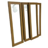 Four oak framed rectangular mirrors