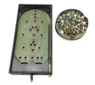 Quantity of vintage glass marbles and bagatelle board