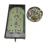 Quantity of vintage glass marbles and bagatelle board