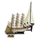 Three wood models of boats