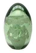 Victorian green glass dump paperweight with flower inclusions