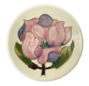 Moorcroft pin dish decorated in the Pink Magnolia pattern on a cream ground