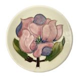 Moorcroft pin dish decorated in the Pink Magnolia pattern on a cream ground