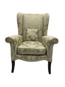 Parker Knoll - wingback armchair upholstered in champagne fabric with foliate pattern