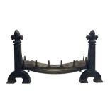 Cast iron fire-dogs or andirons with fire basket