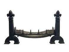 Cast iron fire-dogs or andirons with fire basket