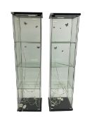 Two four sided glass display cabinets