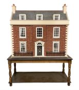 Good quality late 20th century wooden dolls house by M. James dated 1992