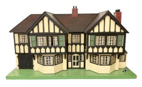 Large Tri-ang No.93 doll`s house in the 'Stockbroker's Range' c1935; two-storey double-fronted Tudor