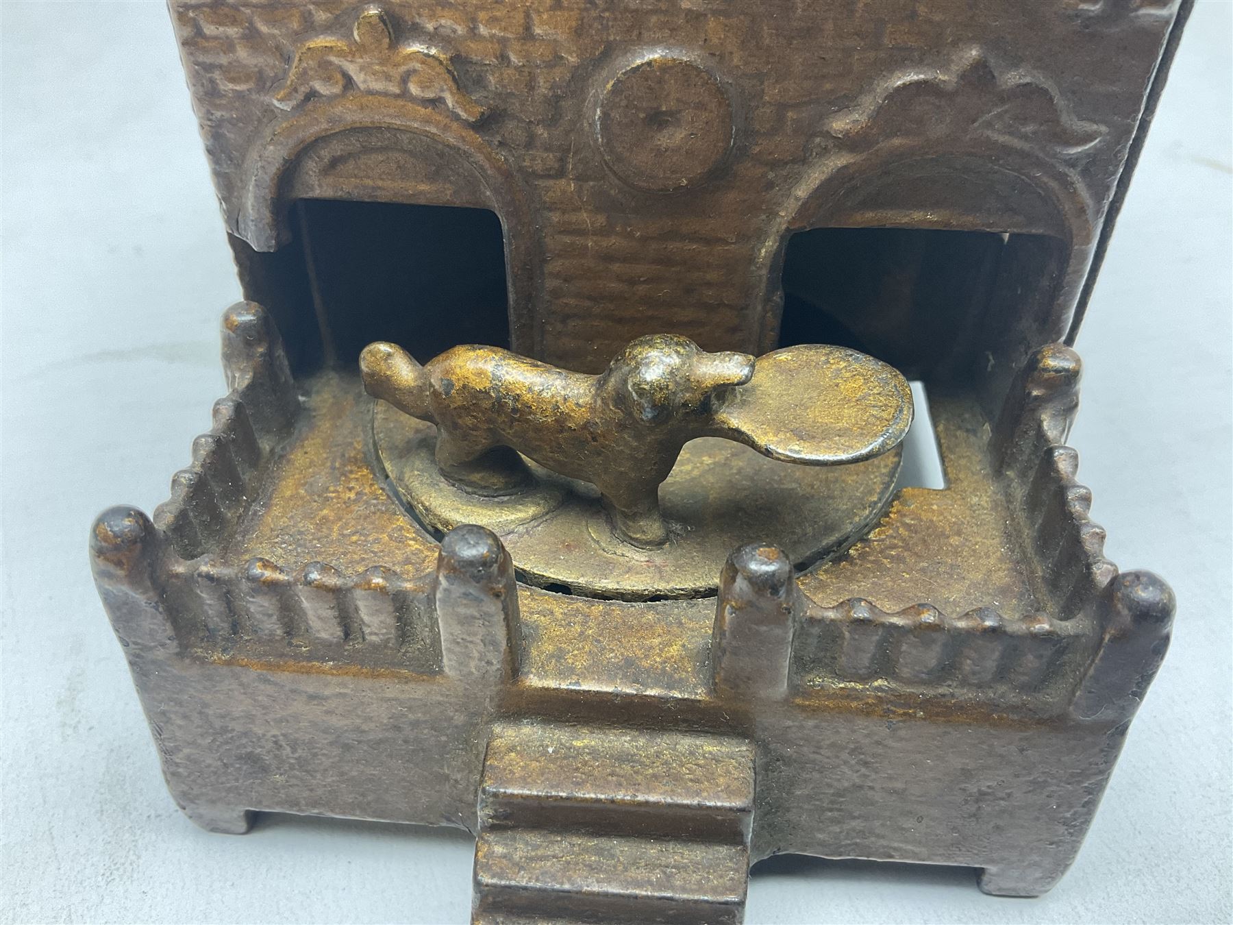 Late 19th century mechanical cast-iron money bank as a dog on a turntable revolving in and out of a - Image 2 of 7