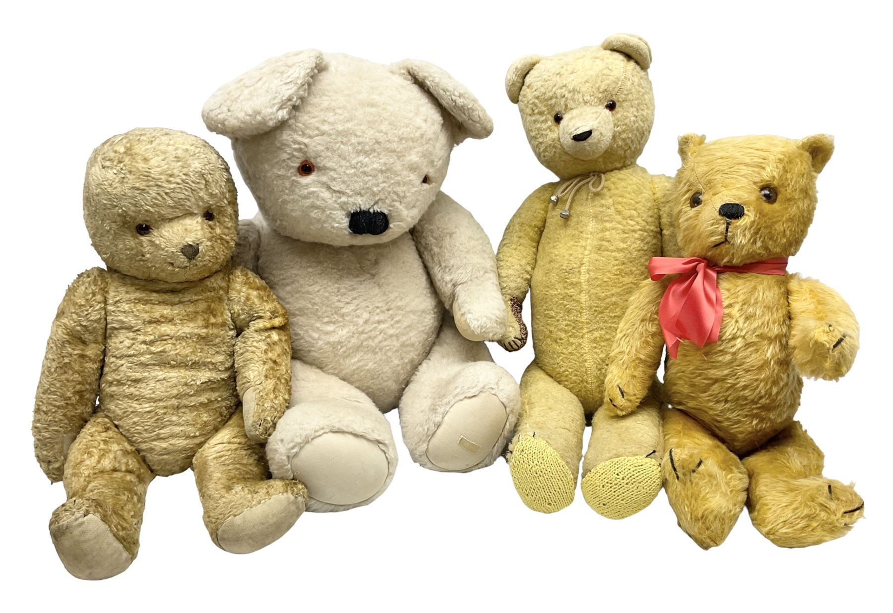 Four mid-20th century and later teddy bears including American style long bodied H71cm; large plush