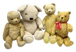 Four mid-20th century and later teddy bears including American style long bodied H71cm; large plush