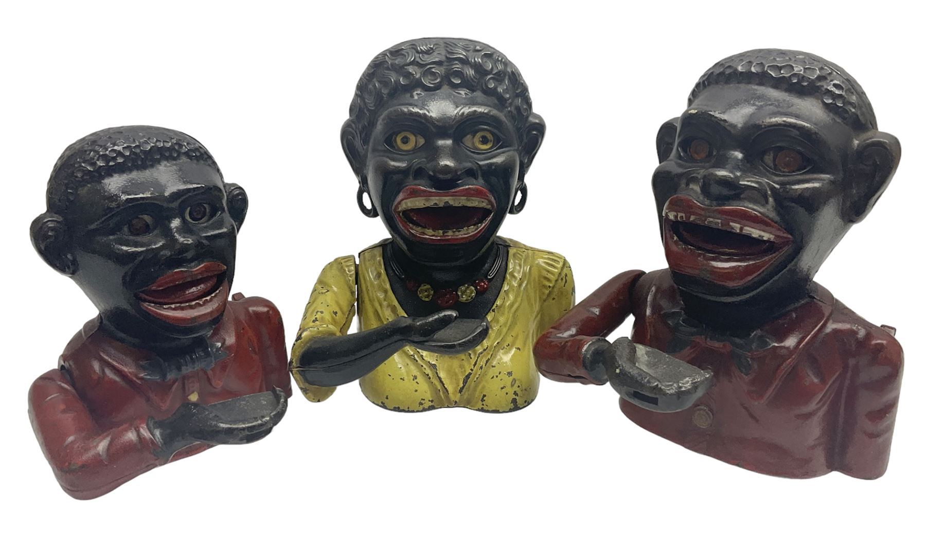 Three early 20th century cast-iron mechanical money banks as a family group comprising mother 'Dinah