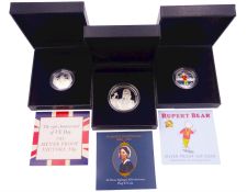 Three silver proof coins comprising Rupert Bear fifty pence