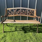 Cast iron an wood slat bench with rose design back rest