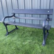 Cast iron and wood slate garden bench painted in black