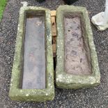 Two rectangular carved stone troughs