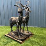 A pair of bronzed cast iron life-size garden or indoor Stags
