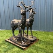 A pair of bronzed cast iron life-size garden or indoor Stags