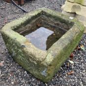 Small carved stone trough