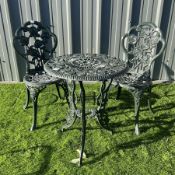 Cast aluminium garden table and two chairs painted in green