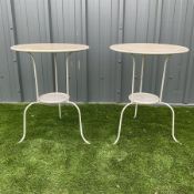 Two circular painted metal tables