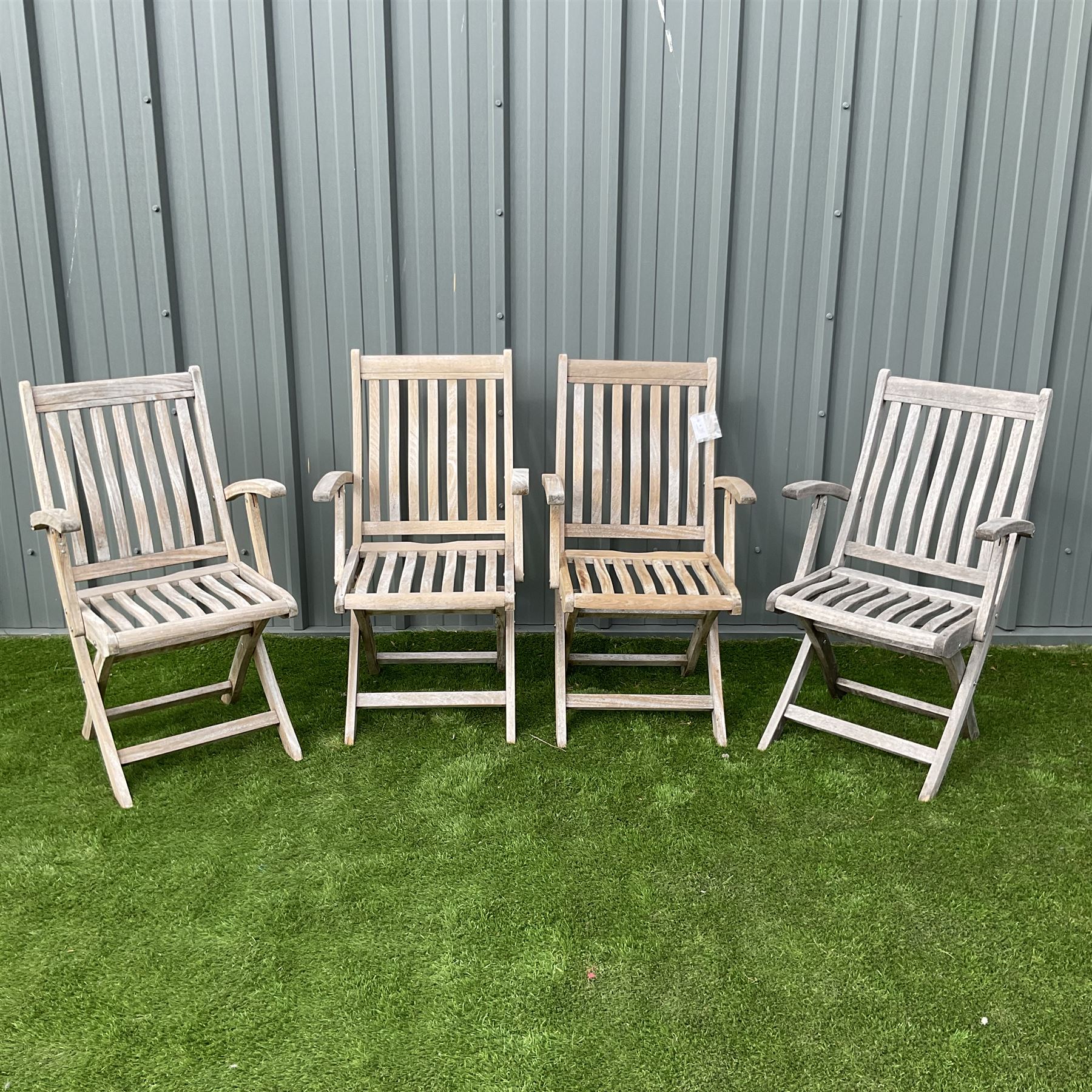 Set four teak slatted folding garden armchairs