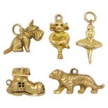 Five 9ct gold charms including Lincoln Imp