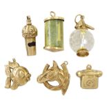 Six 9ct gold charms including horse's head and shoe