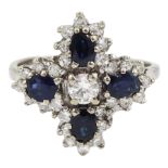 White gold oval sapphire and round brilliant cut diamond cluster ring