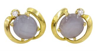 Pair of 18ct gold purple star sapphire and round brilliant cut diamond stud earrings