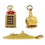 Three 9ct gold charms including telephone box