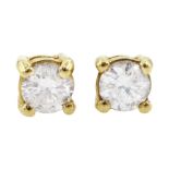 Pair of 18ct gold round brilliant cut diamond stud earrings