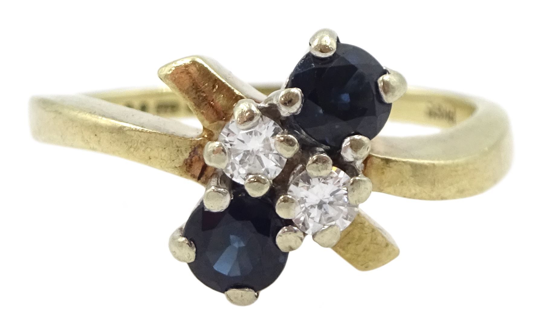 Gold four stone round brilliant cut diamond and sapphire ring