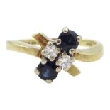 Gold four stone round brilliant cut diamond and sapphire ring