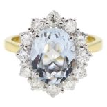 18ct gold oval aquamarine and round brilliant cut diamond cluster ring