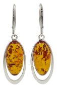 Pair of silver oval amber pendant earrings