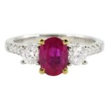 18ct white gold three stone oval ruby and round brilliant cut diamond ring