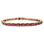 18ct gold emerald cut garnet link bracelet