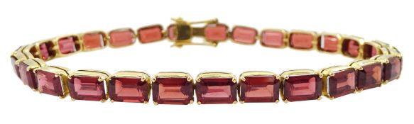 18ct gold emerald cut garnet link bracelet