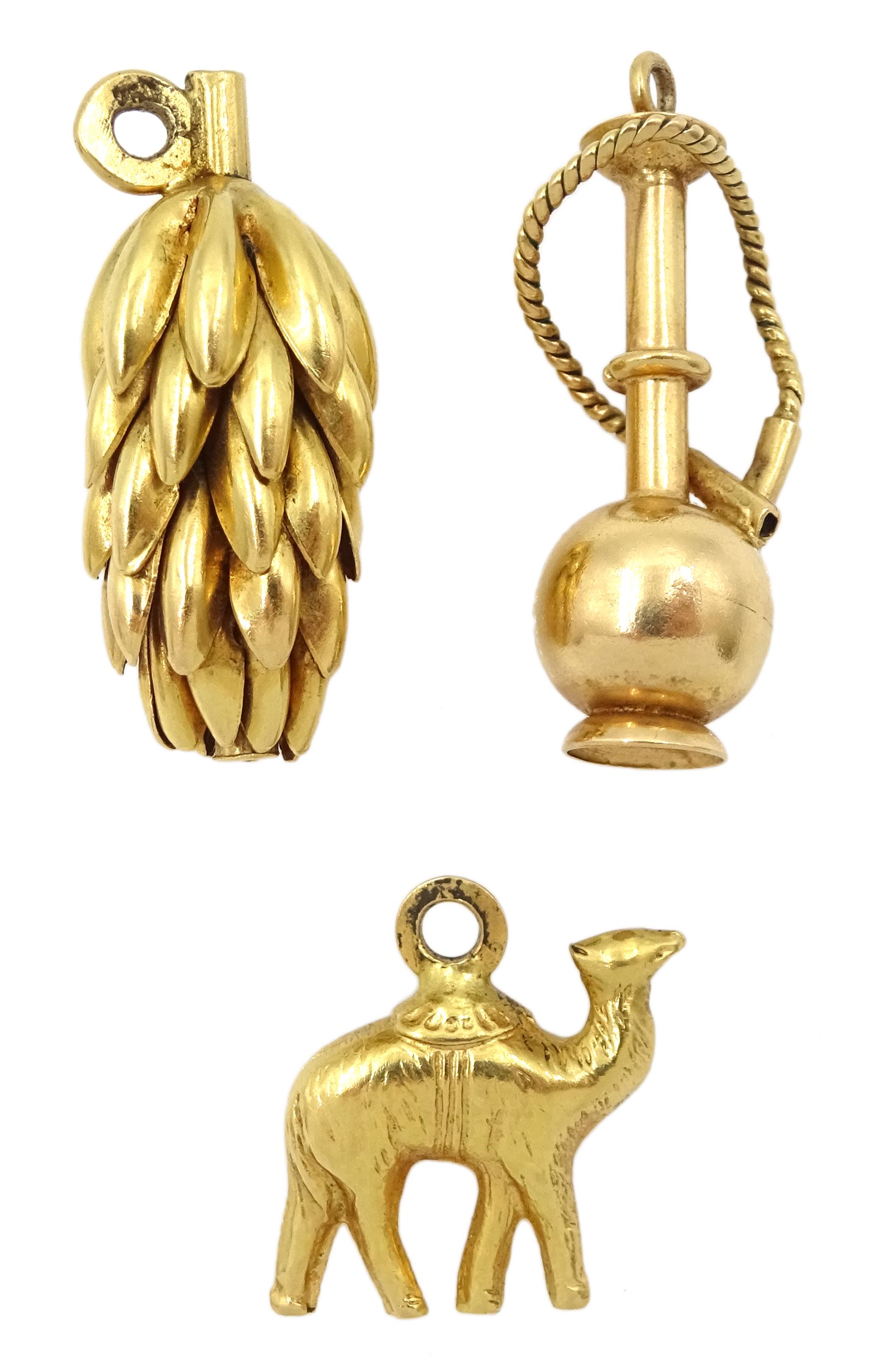 Two 18ct gold banana and camel pendant/charms and a 14ct gold shisha pipe pendant/charm