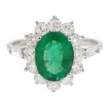 18ct white gold oval emerald and round brilliant cut diamond cluster ring