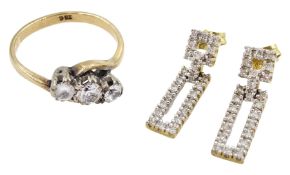 Pair of gold diamond chip pendant stud earrings and a gold three stone cubic zirconia ring